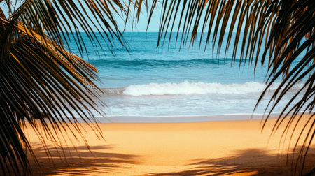 Experience a tranquil escape to a tropical beach where gentle waves meet golden sand, framed by lush palm leaves and bathed in warm sunlight. Perfect for relaxation.の素材