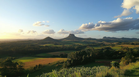 A breathtaking landscape featuring rolling hills and stunning rock formations under a vibrant sunset sky, perfect for capturing the essence of nature's beauty and serenity.の素材
