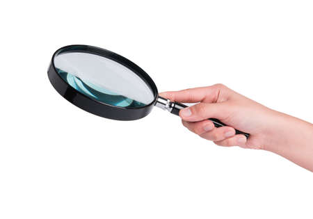 Hand  holding magnifying glassの写真素材