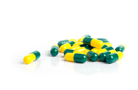 Drug capsules isolated on whiteの写真素材