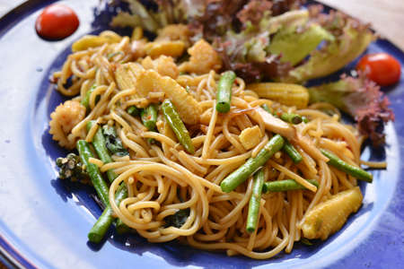 spaghetti with sea food on blue plateの写真素材