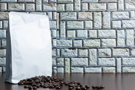 Coffee beans bought in a bag, wooden floor, photographed from the front, close up, back, blurredの写真素材