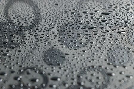 Water droplets, bokeh on a black background, shiny wall reflections, spherical floor designsの写真素材