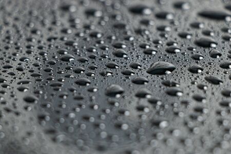 Water droplets bokeh on a blackの写真素材