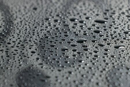 Water droplets bokeh on a blackの写真素材