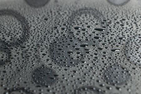 Water droplets bokeh on a blackの写真素材
