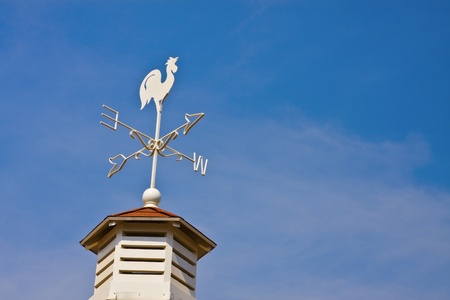 Weathercock on blue skyの写真素材