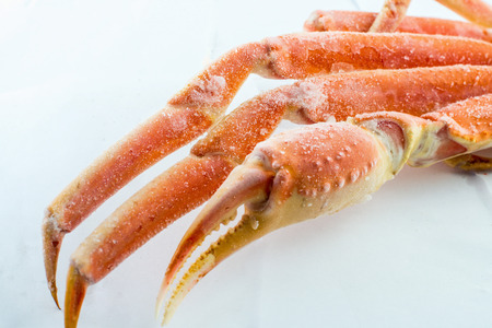 frozen crab claw in a box for sale on the marketの写真素材
