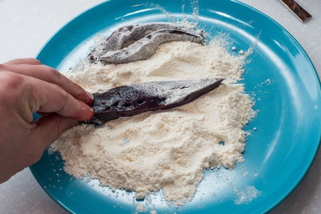 Cooking beef liver covered in flour on a frying pan 1の写真素材