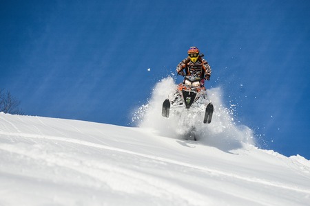 SAKHALIN RUSSIAN - JANUARY 23 : Oleg Bibikov moving snowmobile in winter forest in the mountains of Sakhalin Island in Sakhalin sprint 2015のeditorial素材