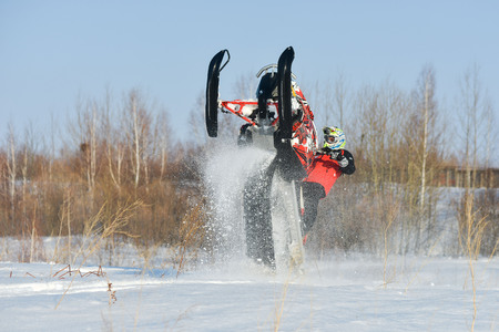 Khabarovsk, Russian - march 19, 2015 : a man rides his snowmobile in snowy fieldのeditorial素材