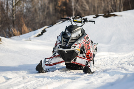 Khabarovsk, Russian - march 19, 2015 : a man rides his snowmobile in snowy fieldのeditorial素材