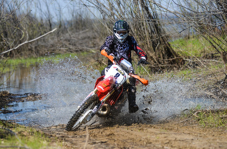 Khabarovsk , Russia - may 10, 2015 : Enduro motorcycle rides through the mud with a big splash at Khabarovsk rally - 2015のeditorial素材
