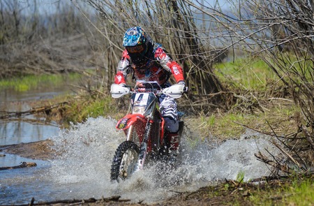 Khabarovsk , Russia - may 10, 2015 : Enduro motorcycle rides through the mud with a big splash at Khabarovsk rally - 2015のeditorial素材