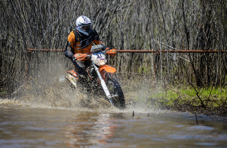 Khabarovsk , Russia - may 10, 2015 : Enduro motorcycle rides through the mud with a big splash at Khabarovsk rally - 2015のeditorial素材