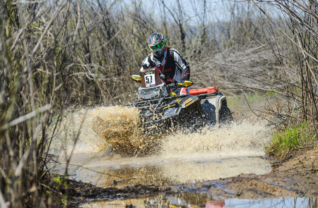 Khabarovsk , Russia - may 10, 2015 : ATV rides through the mud with a big splash at Khabarovsk rally - 2015のeditorial素材