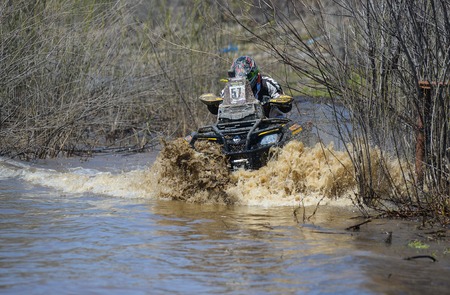 Khabarovsk , Russia - may 10, 2015 : ATV rides through the mud with a big splash at Khabarovsk rally - 2015のeditorial素材