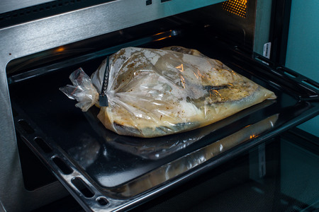 baked fish in the package, ready to be eatenの写真素材