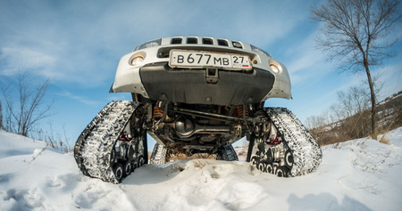 Khabarovsk, Russian - February 19, 2016 : car Suzuki Jimny rides through the snow on tracks in winterのeditorial素材