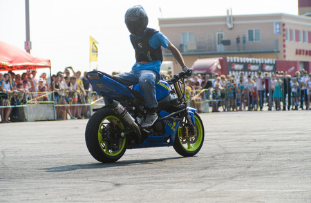 Khabarovsk Russia - July 11, 2015 : a  stunt rider on a sport bike ,on a stunt battle,  July 11, 2015 in Khabarovsk Russiaのeditorial素材
