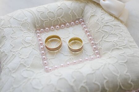 wedding rings in a basket for ringsの写真素材