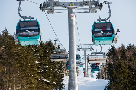 Russia Yuzhno-Sakhalinsk Jan 10, 2014 : Gondola lift system at Gorny Vozdukh ski resort which serves as mass transportation to tourist and visitors.のeditorial素材