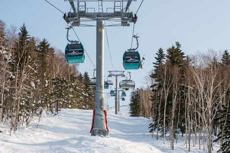 Russia Yuzhno-Sakhalinsk Jan 10, 2014 : Gondola lift system at Gorny Vozdukh ski resort which serves...