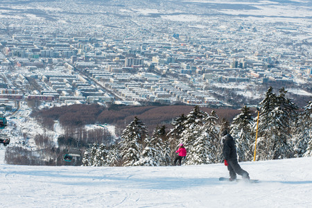 Russia Yuzhno-Sakhalinsk Jan 10, 2014 : View of city and tourist skiing at Gorny Vozdukh ski resort.のeditorial素材