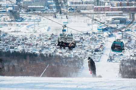 Russia Yuzhno-Sakhalinsk Jan 10, 2014 : Gondola lift system at Gorny Vozdukh ski resort which serves as mass transportation to tourist and visitorsのeditorial素材