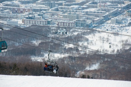 Russia Yuzhno-Sakhalinsk Jan 10, 2014 : View of city and gondola lift system at Gorny Vozdukh ski resort which serves as mass transportation to tourist and visitors.のeditorial素材