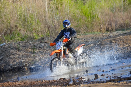 Vladivostok, Russia - may 1, 2014: motorcycle, ktm Enduro  go off-roading in five-day race Russian rally 2014のeditorial素材
