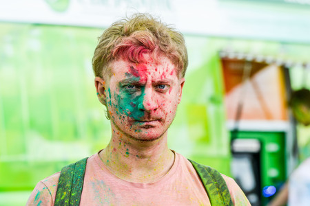 Khabarovsk, Russia - June 25, 2016: Tourist with students celebrating Holi on 25 July 2016 in Khabarovsk, Russia. Holi is a spring festival celebrated as a festival of colors.のeditorial素材