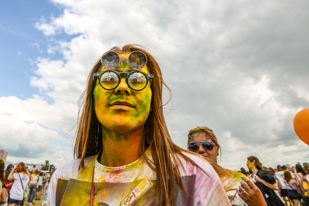 Khabarovsk, Russia - June 25, 2016: Tourist with students celebrating Holi on 25 July 2016 in Khabarovsk, Russia. Holi is a spring festival celebrated as a festival of colors.のeditorial素材