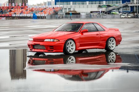 driver drives a Nissan skyline R 32 red, on pools 9 July 2016 in Khabarovsk, Russiaのeditorial素材