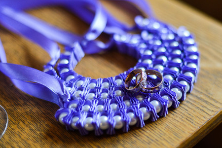 wedding rings in a basket for ringsの写真素材