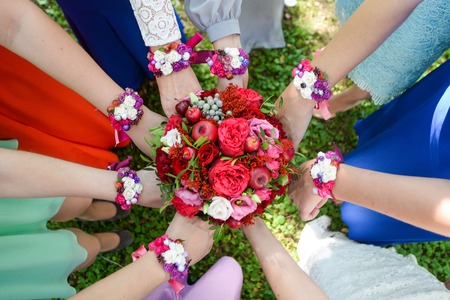Bridal bouquet with different flowers, honey , and red. the bridesmaidsの写真素材