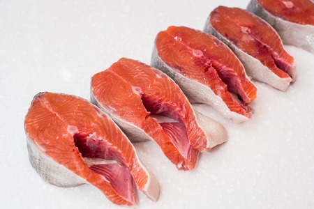 raw salmon fillet isolated on white background for cooking