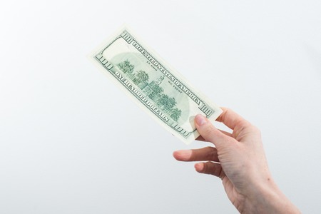 girl believes the dollars in hand on white background