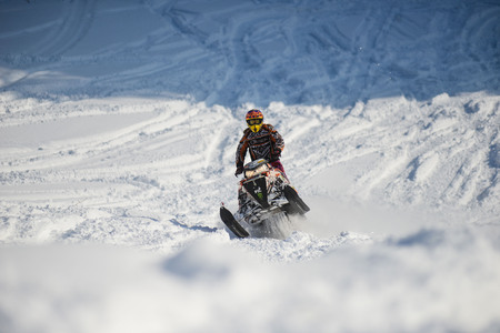 SAKHALIN RUSSIAN - JANUARY 23 : Oleg Bibikov moving snowmobile in winter forest in the mountains of Sakhalin Island in Sakhalin sprint 2015のeditorial素材