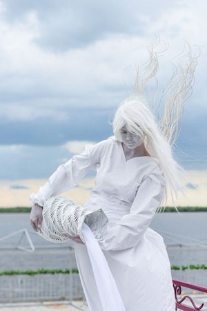 Khabarovsk, Russia 18.06.2016. Living statue is moving before the public. Sad Aquarius.のeditorial素材