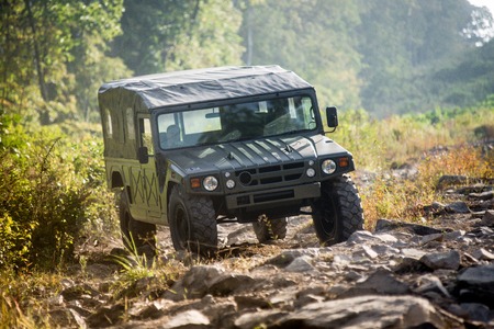 VLADIVOSTOK, RUSSIA - SEPTEMBER 22, 2015: Motor car Toyota Mega Cruiser driving on a forest roadのeditorial素材