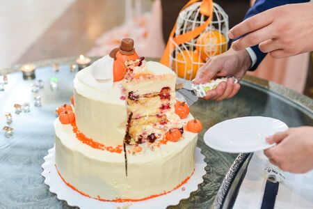 Wedding cake with red roses wedding cake. orangeの写真素材