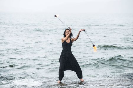 fire show on the shore of the seaの写真素材