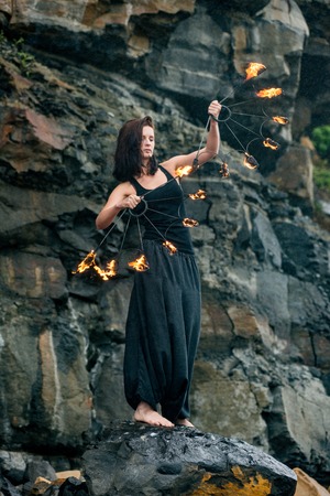 play with fire show on the shore of the seaの写真素材