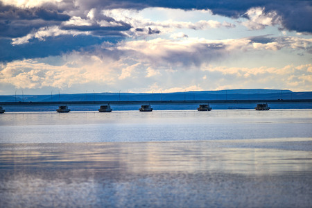 Wooden bridge in shallow watersの写真素材