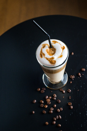 Fancy latte coffee in glassの写真素材
