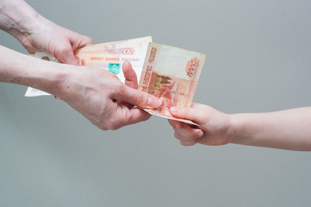 hand with stack of Russian moneyの写真素材