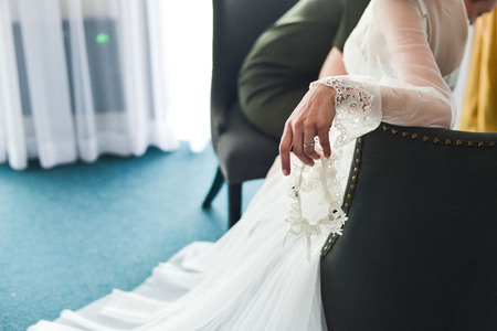 Garter on the leg of a bride, Wedding day momentsの写真素材