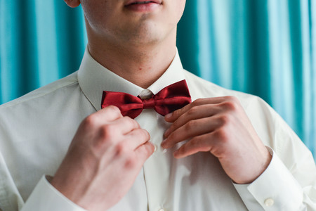 Close-up of a gentleman wearing Black . tie
