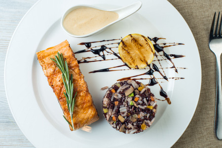 steak fish with rice Plate on Vintage Wood Table.の写真素材